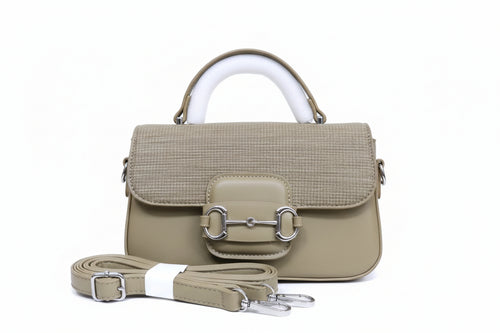 Green handbag with white handle and strap on a matching box, with Burberry logo.
