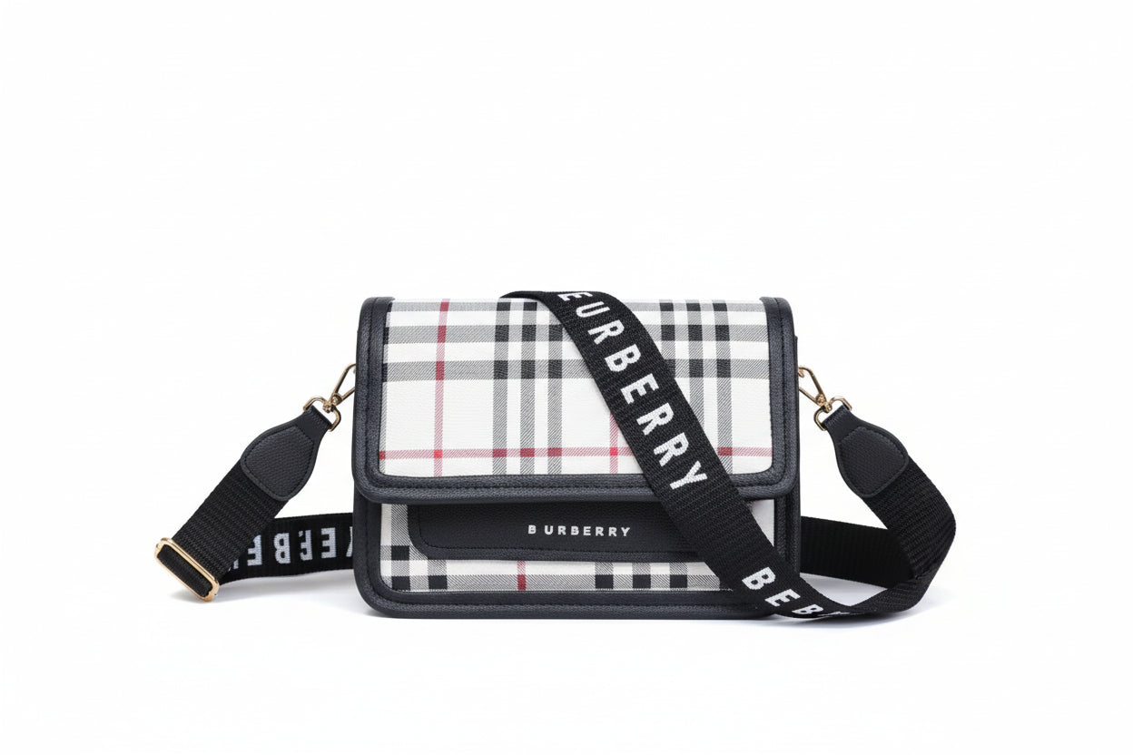 Burberry handbag with checkered strap in a box on a light background