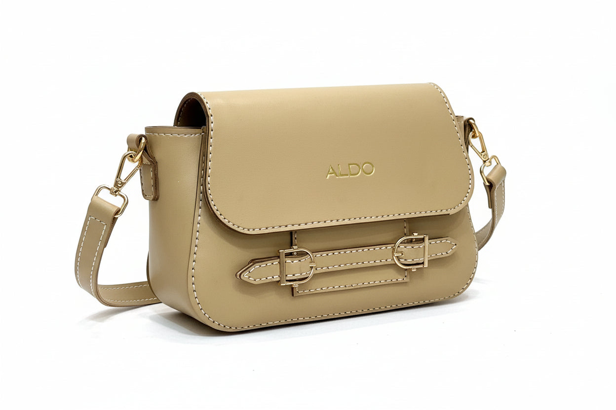 Beige handbag with 'ALDO' branding on a wooden surface