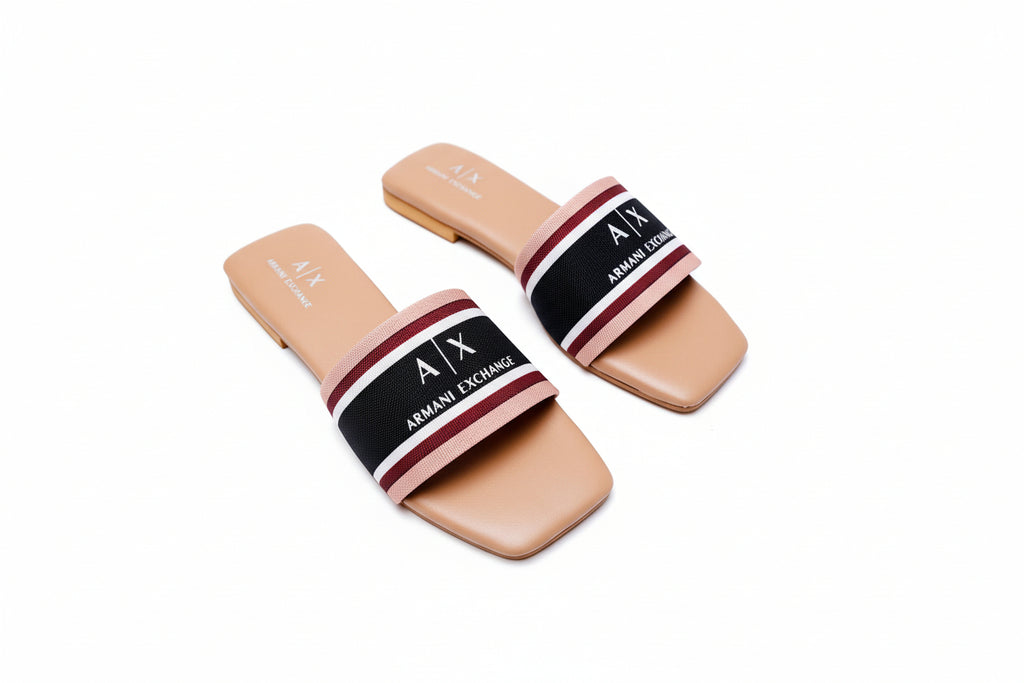 Pair of Armani Exchange slides on a white surface